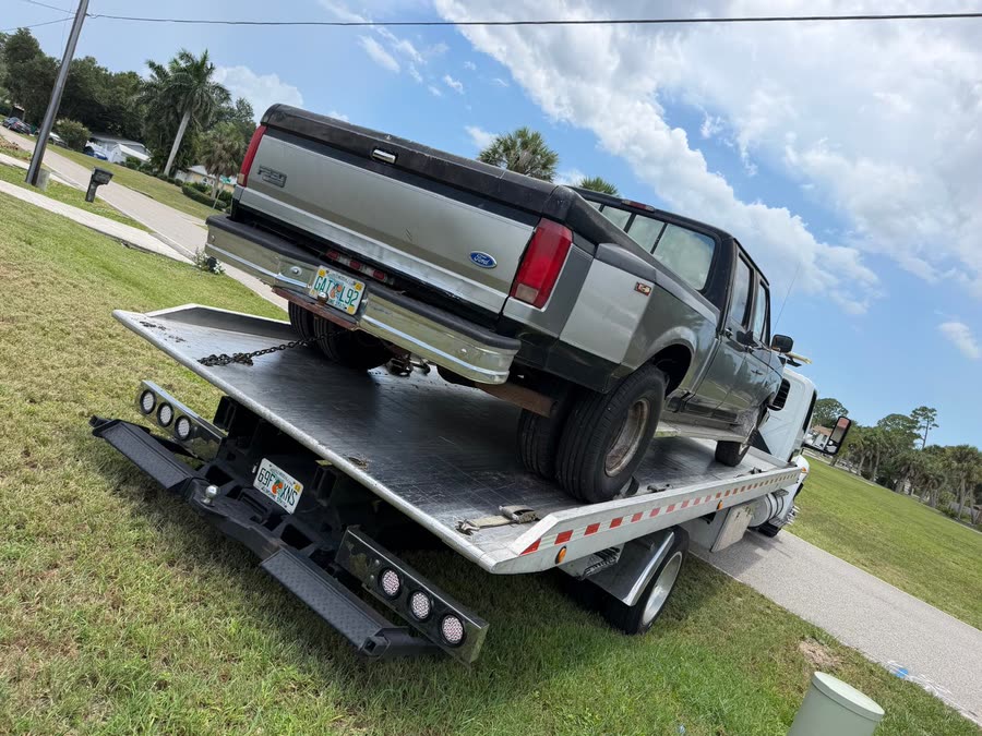 Ford F-350 pickup loaded on the flatbed