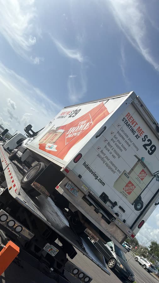 Rental box truck loaded on the tow truck